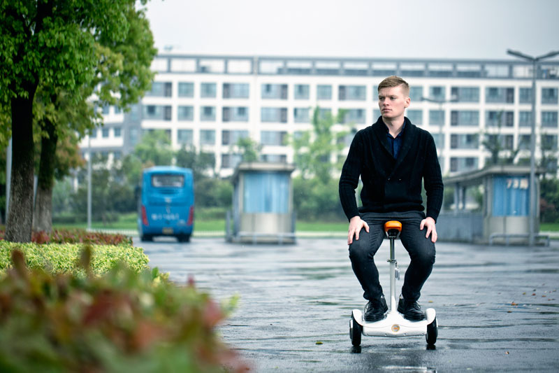 two wheel saddle-equipped scooter